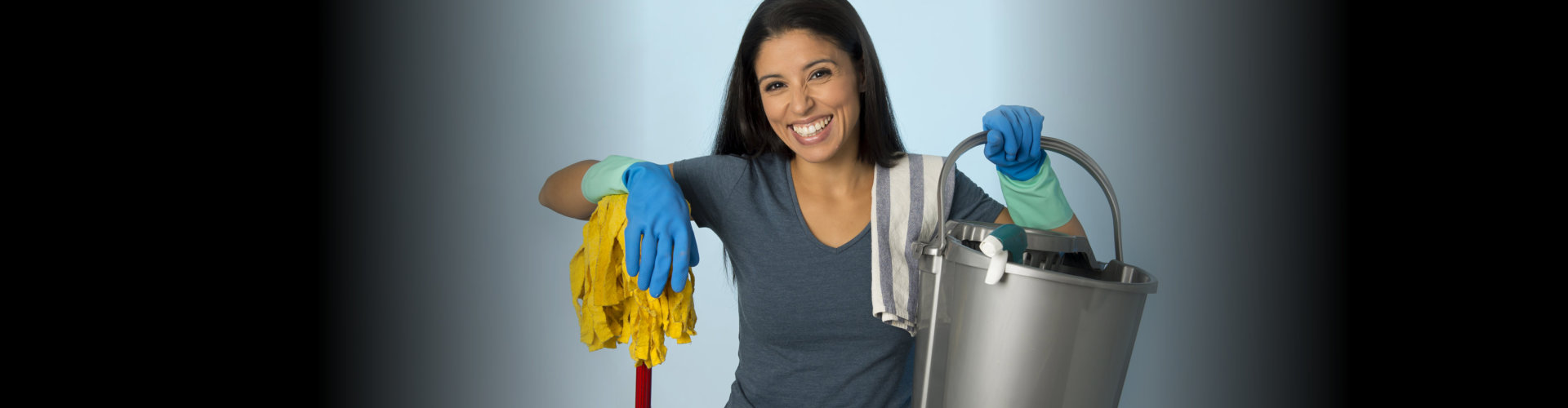 woman holding a cleaning tools
